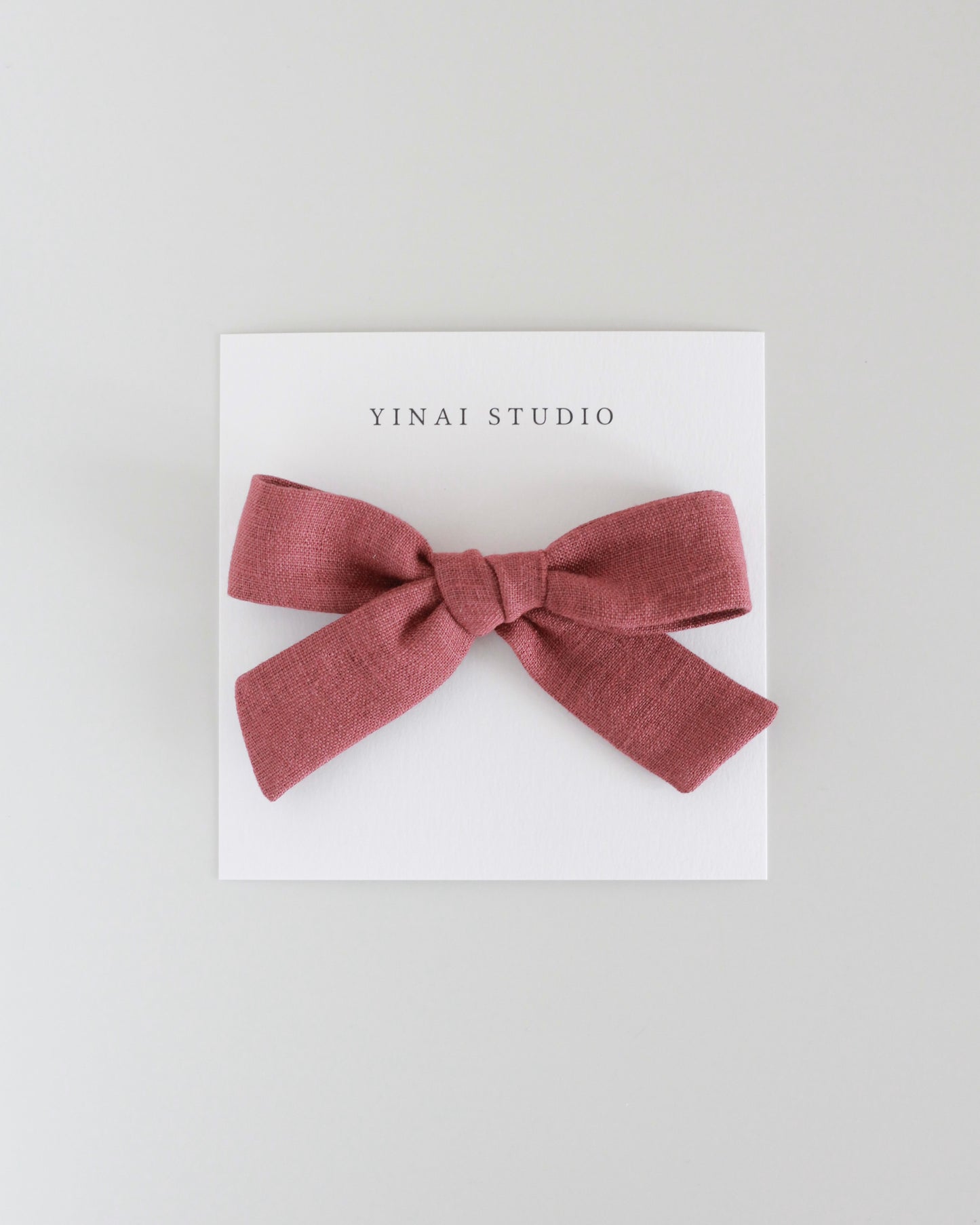 BOW CLIP [medium] - Reddish brown